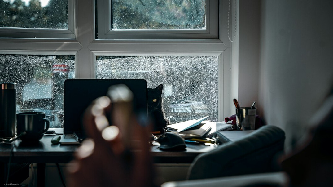 person meditating at desk